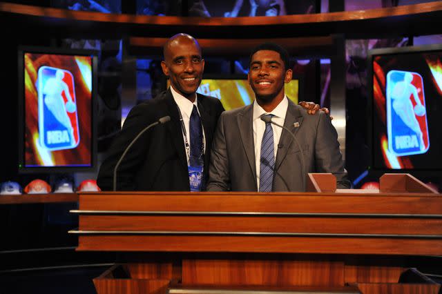 <p>Jesse D. Garrabrant/NBAE via Getty </p> Kyrie Irving poses with his father, Drederick Irving, ahead of the 2011 NBA Draft Lottery.