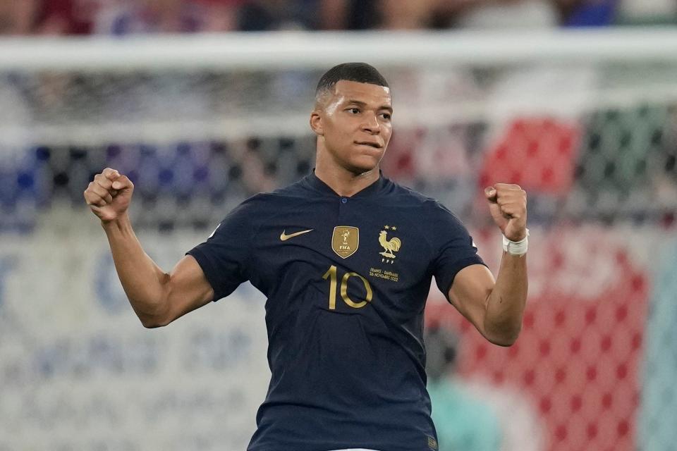 France's Kylian Mbappe celebrates at the end of the World Cup group D soccer match between France and Denmark, at the Stadium 974 in Doha, Qatar, Saturday, Nov. 26, 2022. (AP Photo/Christophe Ena)