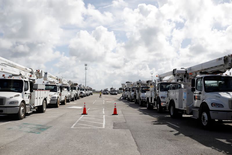 Trucks of the Florida Power & Light Company are seen ahead of the arrival of Hurricane Dorian in Daytona Beach