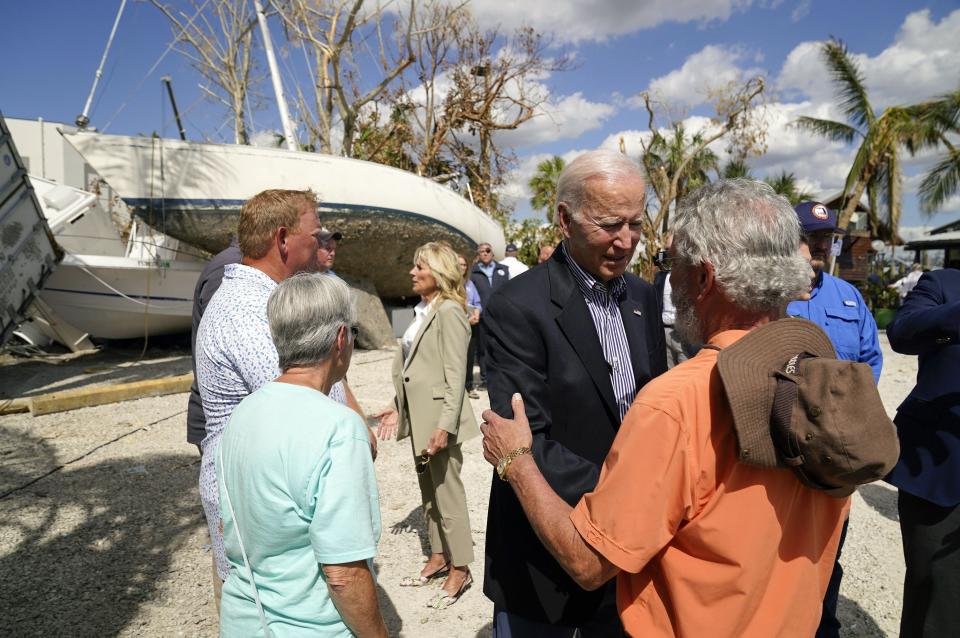 President Joe Biden and first lady Jill Biden talk to people impacted by Hurricane Ian during a tour of the area on Wednesday, Oct. 5, 2022, in Fort Myers Beach, Fla. (AP Photo/Evan Vucci)