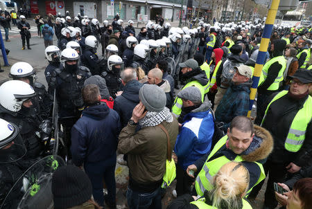 Demonstrators are blocked by police during the "yellow vests" protest against higher fuel prices, in Brussels, Belgium, December 8, 2018. REUTERS/Yves Herman