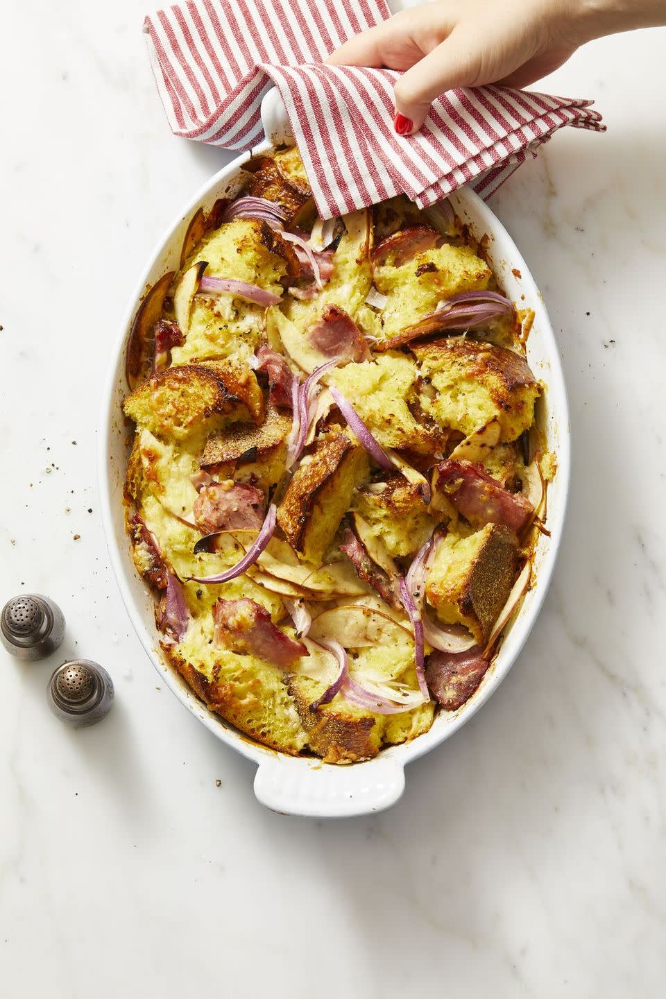 <p>Turn leftover stuffing into bread pudding! Just add enough eggs and milk to moisten if dry, then fold in onion, apple, ham and Cheddar and bake until hot and crispy.</p><p><em><a href="https://www.goodhousekeeping.com/food-recipes/a29305072/ham-cheddar-and-red-onion-bread-pudding/" rel="nofollow noopener" target="_blank" data-ylk="slk:Get the recipe for Ham, Cheddar, and Red Onion Bread Pudding »;elm:context_link;itc:0;sec:content-canvas" class="link ">Get the recipe for Ham, Cheddar, and Red Onion Bread Pudding »</a></em></p>