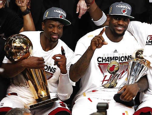 Miami’s Dwyane Wade (left) holds the the Larry O’Brien NBA Championship Trophy and LeBron James holds his most valuable player trophy after Game 5 of the NBA finals on June 22, 2012 in Miami.Lynne Sladky | Associated Press