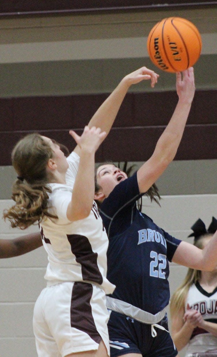 Bartlesville High's Kate Gronigan, right, spars with a Jenks High player during action this week.