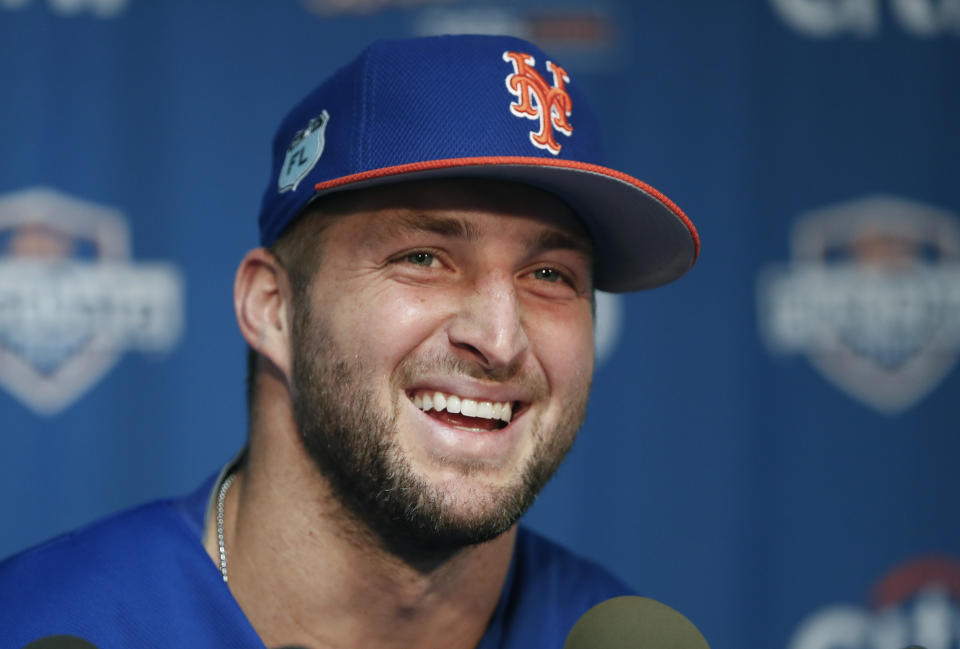 Tim Tebow is still playing baseball, and he’ll be spending a little time in the Mets’ major league spring training camp. (AP Photo)