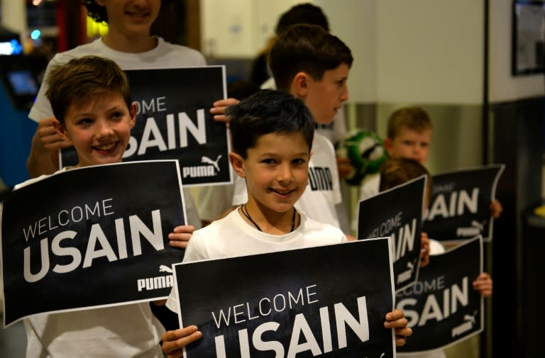 Fans and a media scrum were waiting for Bolt at Sydney airport