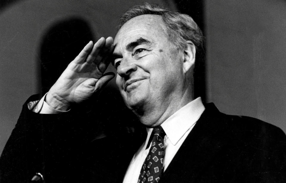 In this April 26, 1994, photo, Sen. Harris Wofford, D-Pa., salutes at the Pittsburgh Hilton and Towers during the opening session of the Pennsylvania AFL-CIO convention. Former Pennsylvania Sen. Harris Wofford died in the hospital late Monday night, Jan. 21, 2019, of complications from a fall Saturday in his Washington apartment, his son, Daniel Wofford, said. He was 92. (Peter Diana/Pittsburgh Post-Gazette via AP)