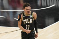 Atlanta Hawks' Trae Young (11) reacts after he scores during the second half of Game 4 of a second-round NBA basketball playoff series against the Philadelphia 76ers on Monday, June 14, 2021, in Atlanta. (AP Photo/Brynn Anderson)