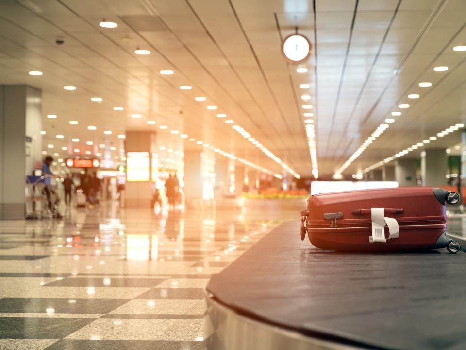 A suitcase on a baggage carousel