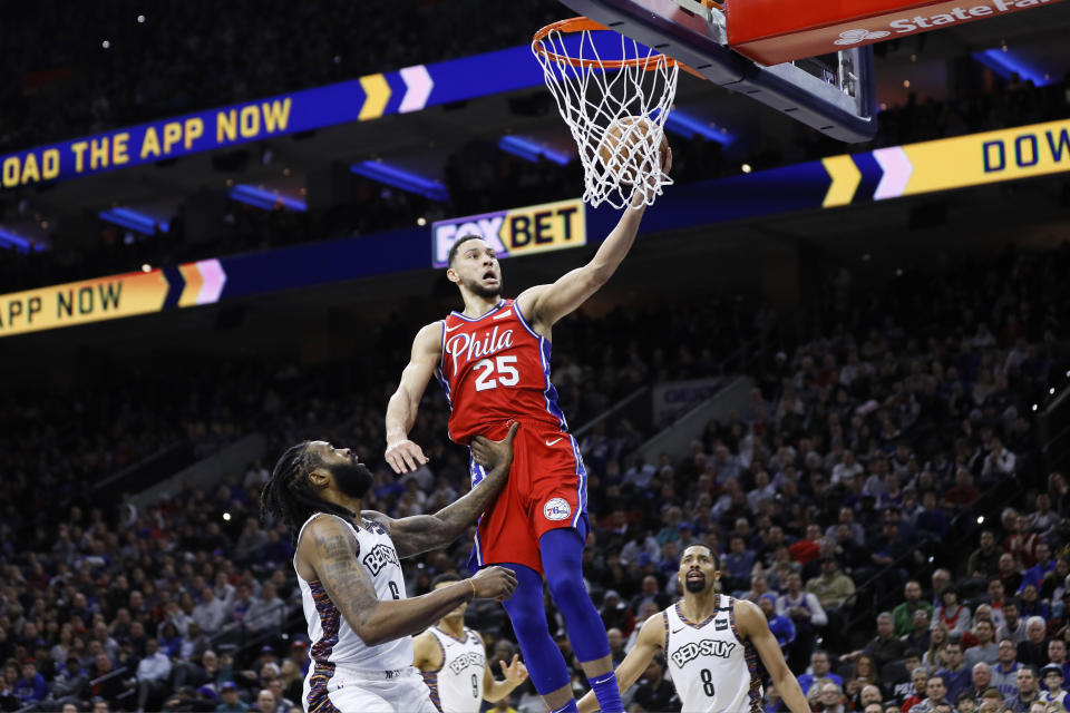 Philadelphia 76ers' Ben Simmons (25) goes up for a shot against Brooklyn Nets' DeAndre Jordan (6) during the first half of an NBA basketball game, Wednesday, Jan. 15, 2020, in Philadelphia. (AP Photo/Matt Slocum)