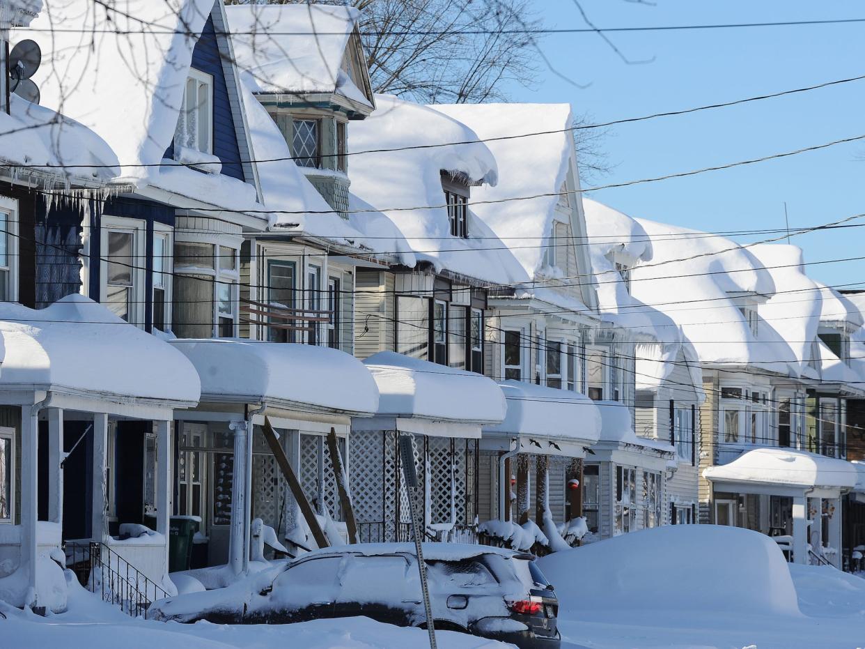 Snow covered homes after an intense lake-effect snowstorm that impacted the area on November 20, 2022 in Buffalo, New York.