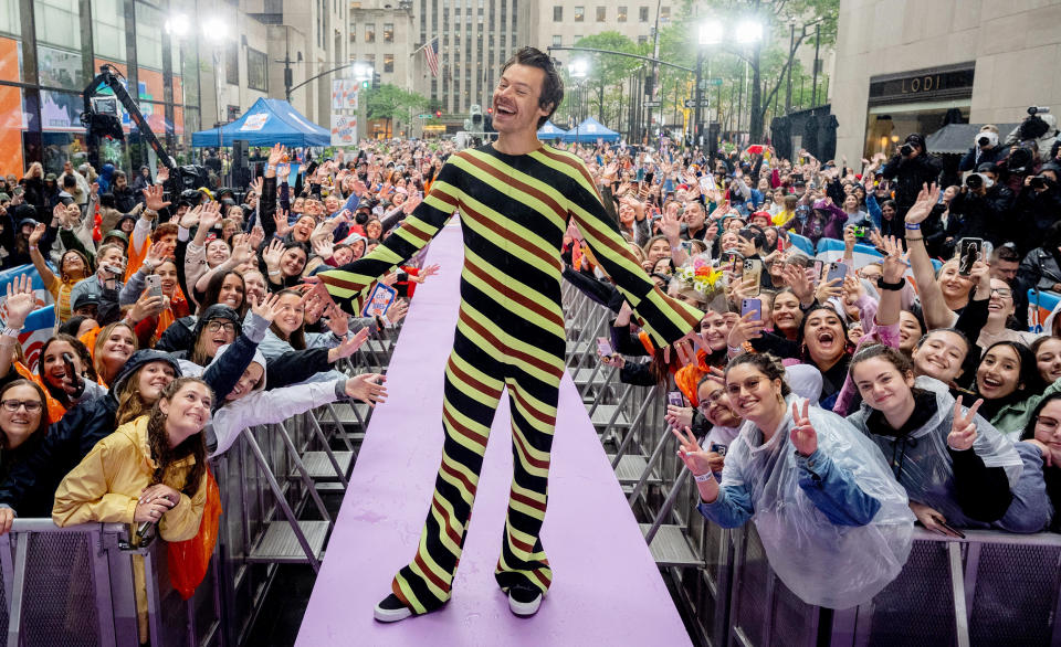 Styles candy-striped onesie was a hit with fans on the plaza. 