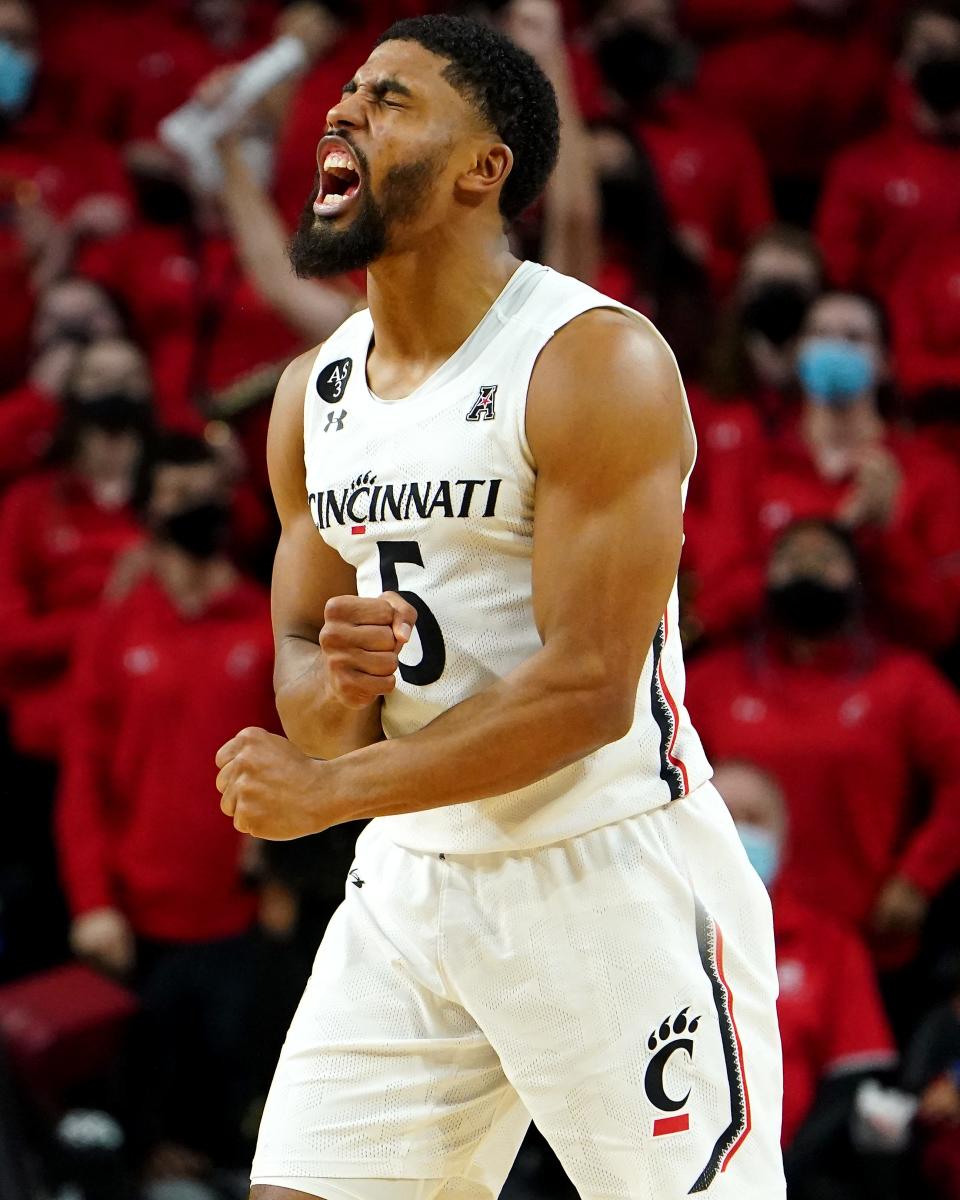 Cincinnati Bearcats guard David DeJulius (5) reacts after a defensive stop in the second half of an NCAA basketball game against the Temple Owls, Sunday, Feb. 20, 2022, at Fifth Third Arena in Cincinnati. The Temple Owls won, 75-71. 