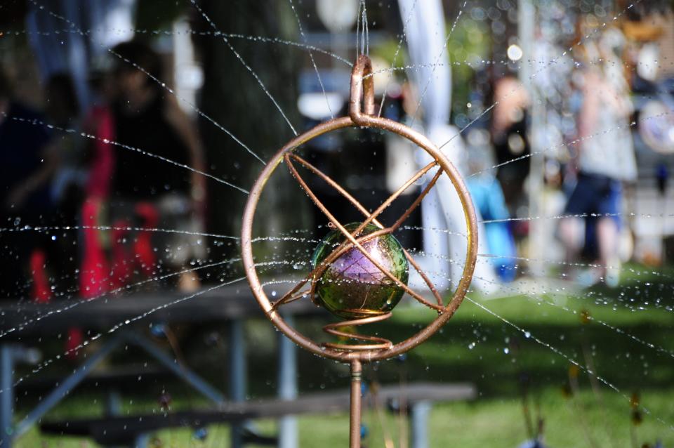 A copper sprinkler created by Jim Cook of Fremont spins at the Algonac Art Fair on Saturday, Sept. 1, 2018.