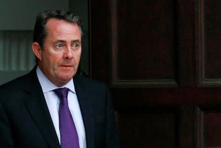 Britain's Defence Secretary Liam Fox leaves his residence in central London October 13, 2011. REUTERS/Suzanne Plunkett/File Photo