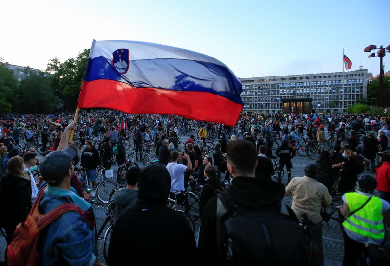 Protesters ride bicycles during an anti-government protest in Ljubljana