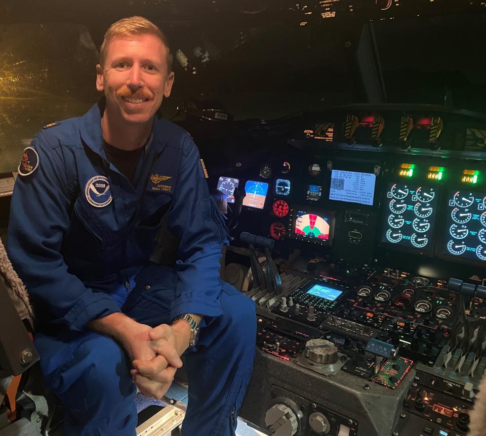 NOAA Commissioned Officer Corps. Lt. Cmdr. Kevin Doremus sits in the flight station of WP-3D Orion "Miss Piggy" before an August mission to investigate Hurricane Ida.