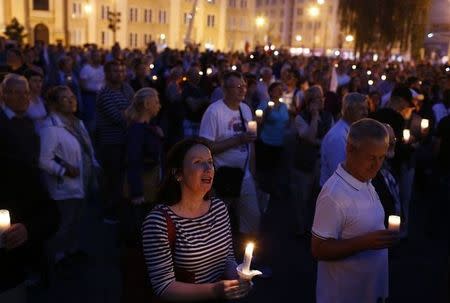 People hold candles during a protest against supreme court legislation in front of the Supreme Court in Warsaw, Poland, July 21, 2017. REUTERS/Kacper Pempel