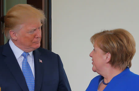 U.S. President Donald Trump welcomes German Chancellor Angela Merkel at the White House in Washington, U.S., April 27, 2018. REUTERS/Brian Snyder