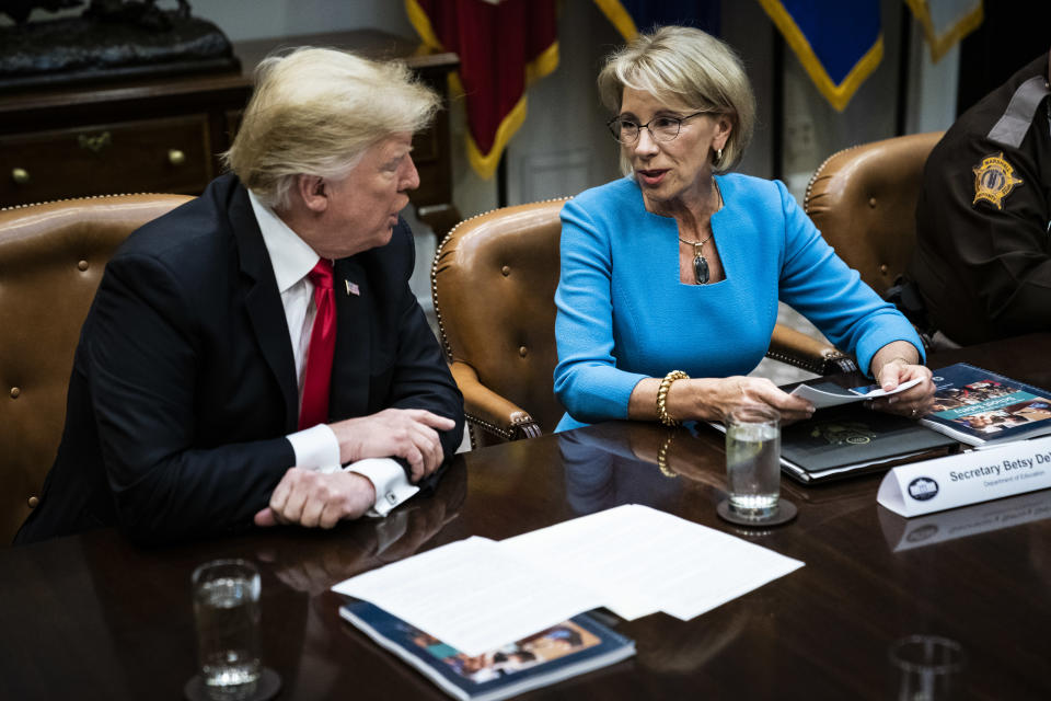 President Donald J. Trump speaks with Secretary of Education Betsy DeVos in the Roosevelt Room at White House on Tuesday, Dec. 18, 2018 in Washington, DC. (Photo: Jabin Botsford/The Washington Post via Getty Images)