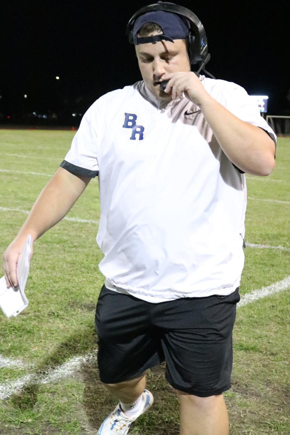 Assistant coach, Alex Savakinas, disappointed after a Monarch touchdown