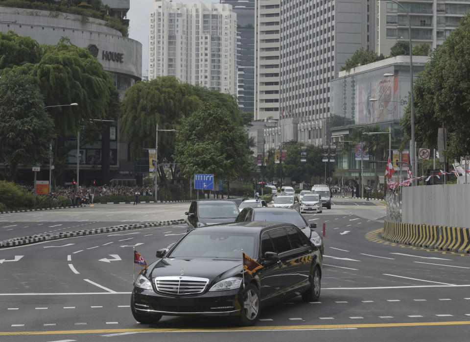 In this June 10, 2018, file photo, the North Korean Motorcade believed to be carrying Kim Jong Un travels past Singapore's Orchard Road on its way to the St Regis Hotel ahead of the first summit with U.S. President Donald Trump. Trump and Kim are planning a second summit in the Vietnam capital of Hanoi, Feb. 27-28. (AP Photo/Joseph Nair, File)