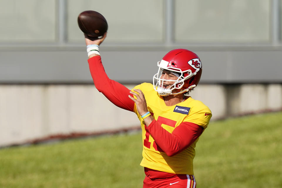 Kansas City Chiefs quarterback Patrick Mahomes throws during an NFL football training camp Friday, Aug. 14, 2020, in Kansas City, Mo. (AP Photo/Charlie Riedel)