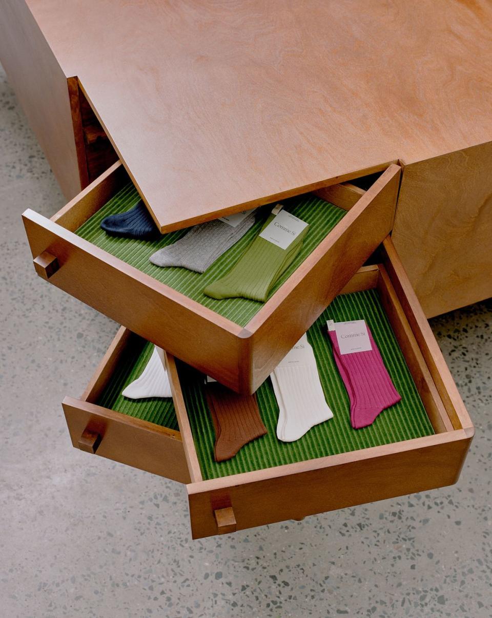 a wooden box with books inside