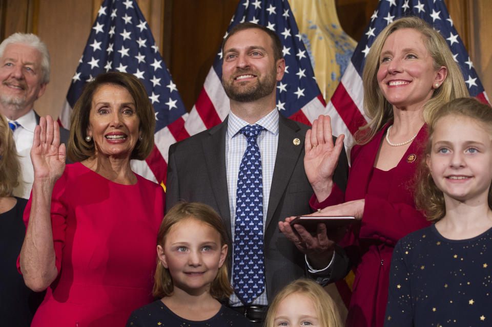 House Speaker Nancy Pelosi of Calif., right, poses during a ceremonial swearing-in with Rep. Abigail Spanberger, D-Va., right, on Capitol Hill in Washington, Thursday, Jan. 3, 2019, during the opening session of the 116th Congress. Washington, Thursday, Jan. 3, 2019. (AP Photo/Cliff Owen)