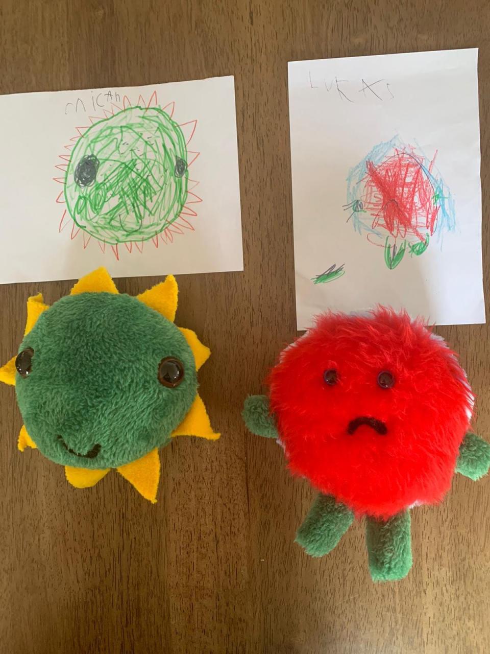 A drawing of a monster and the monster made into a toy that looks exactly like it