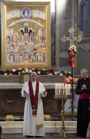 Pope Francis leads a mass at the Basilica of Saint Bartholomew on Tiber island in Rome, April 22, 2017. REUTERS/Maurizio Brambatti/Pool