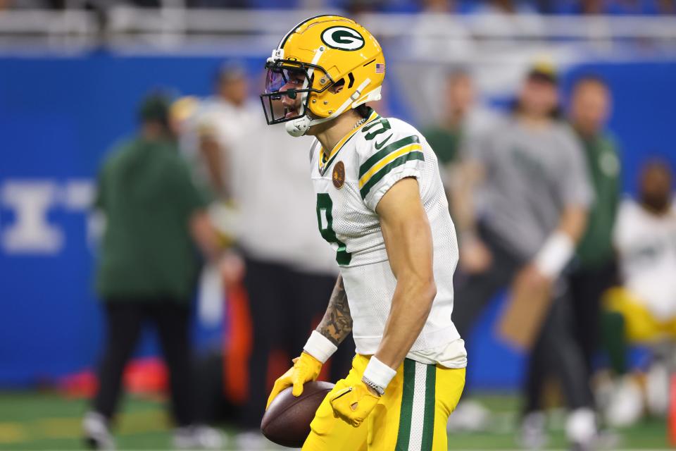 Christian Watson reacts after catching a 53-yard pass on the game's first offensive play for the Packers on Thursday against the Detroit Lions. Watson had season-highs in catches (five) and yards (94).