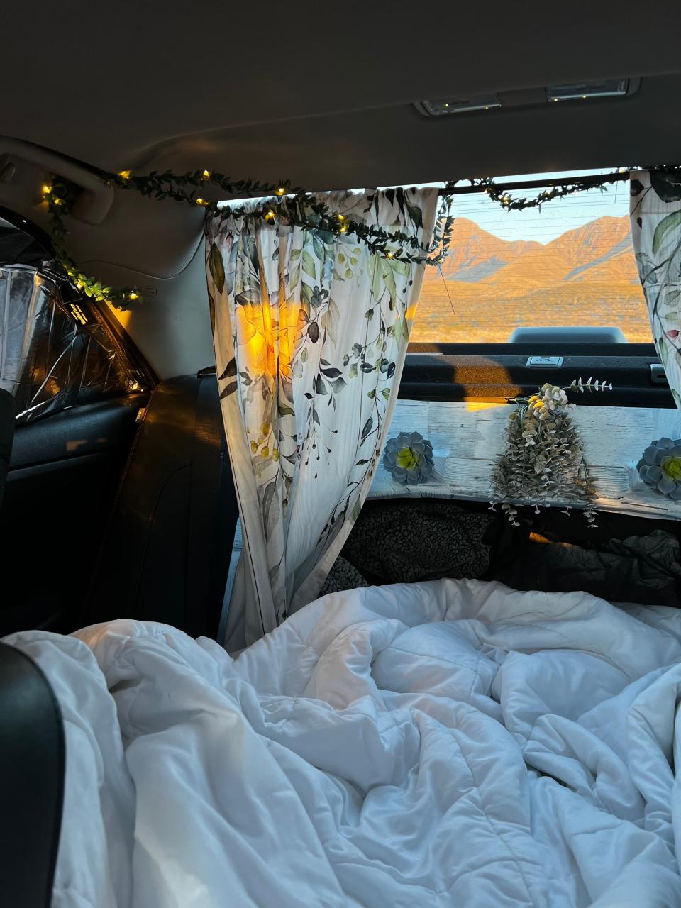 The inside of Monica's car where she sleeps.