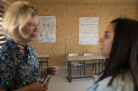 European Union representatives visit a school structure that is under the threat of demolition by the Israeli authorities, in the West Bank Bedouin community of Ein Samia, northeast of Ramallah, Friday, Aug. 12, 2022. The Israeli District Court in Jerusalem issued on Wednesday a decision to immediately demolish the Ein Samia school. Fifty four schools serving seven thousand Palestinian children in the West Bank's area "C" are under threat of demolition, Sven Kühn von Burgsdorff, the European Union's representative to the West Bank and Gaza told reporters. (AP Photo/Nasser Nasser)