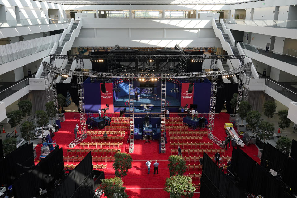 Preparations take place for the first Presidential debate in the Sheila and Eric Samson Pavilion, Monday, Sept. 28, 2020, in Cleveland. The first debate between President Donald Trump and Democratic presidential candidate, former Vice President Joe Biden is scheduled to take place Tuesday, Sept. 29. (AP Photo/Patrick Semansky)