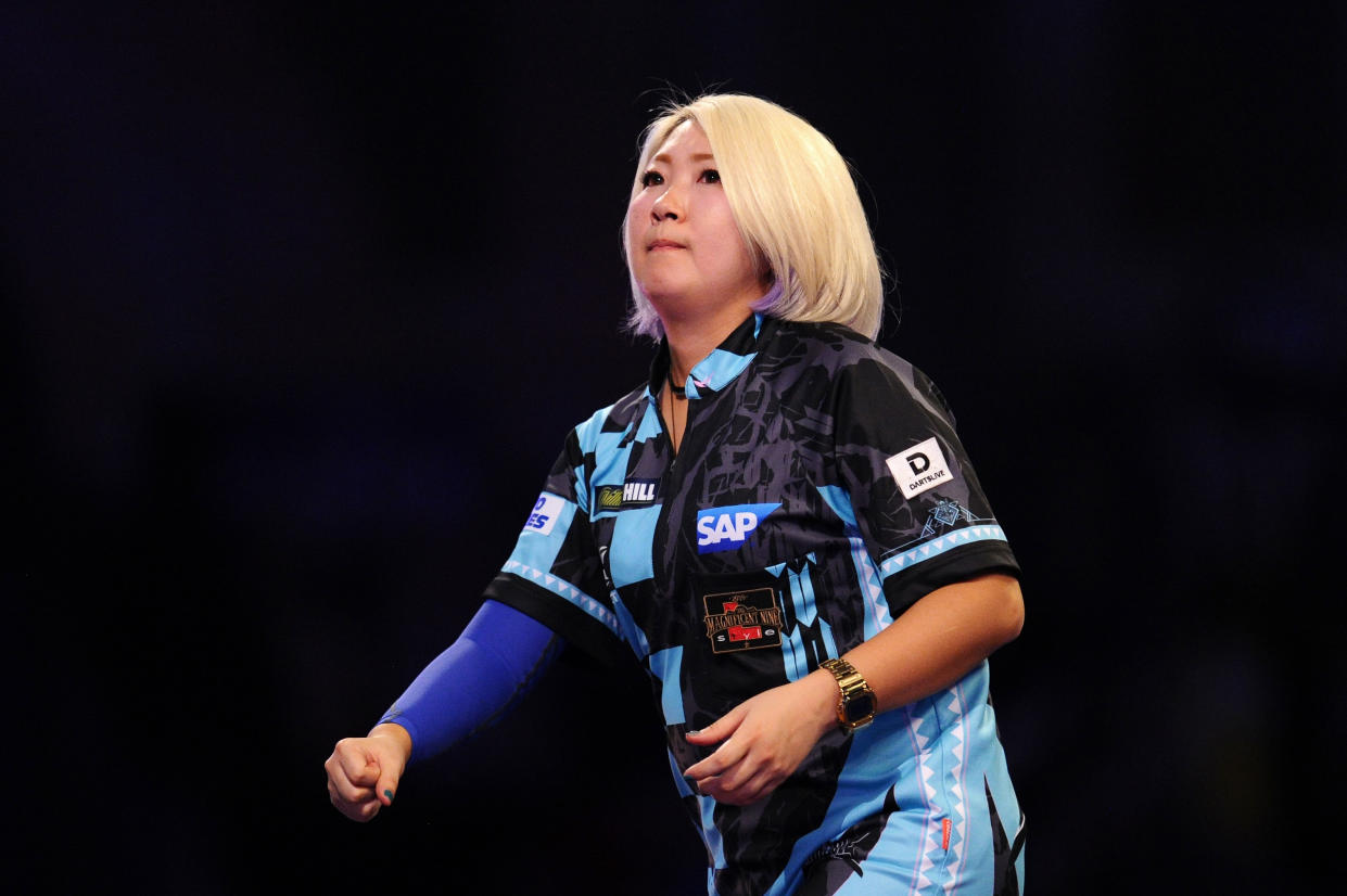 LONDON, ENGLAND - DECEMBER 15: Mikuru Suzuki of Japan celebrates in her First Round match against James Richardson of England during Day Three of the 2020 William Hill World Darts Championship at Alexandra Palace on December 15, 2019 in London, England. (Photo by Alex Burstow/Getty Images)