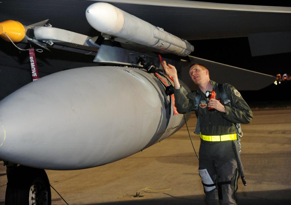 Oregon Air National Guard Col. Adam Sitler, 142nd Fighter Wing vice commander, inspects an F-15 Eagle prior to his night sortie at Nellis Air Force Base, Nev., June 5, 2017. Over 120 Oregon Air Guardsmen are supporting the Weapons Instructor Course during their three-week duty assignment. (U.S. Air National Guard photo by Master Sgt. John Hughel, 142nd Fighter Wing Public Affairs)