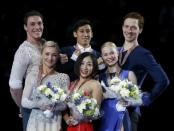 Figure Skating - ISU World Championships 2017 - Pairs Victory Ceremony - Helsinki, Finland - 30/3/17 - Gold medallists Sui Wenjing and Han Cong of China (C), silver medallists Aliona Savchenko and Bruno Massot of Germany (L) and bronze medallists Evgenia Tarasova and Vladimir Morozov of Russia attend the ceremony. REUTERS/Grigory Dukor