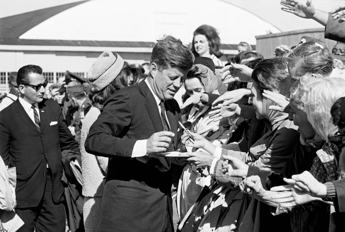 President John F. Kennedy signing autographs at Carswell Air Force Base in Fort Worth on the way to Dallas Love Field. Nov. 22, 1963