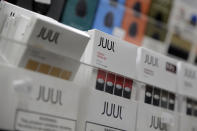 FILE - In this Dec. 20, 2018, file photo Juul products are displayed at a smoke shop in New York. Philip Morris and Altria have ended merger talks and JUUL’s CEO is stepping down from the top post as criticism over vaping continues to intensify. The companies confirmed last month that they were in discussions, more than a decade after splitting itself into two companies. (AP Photo/Seth Wenig, File)