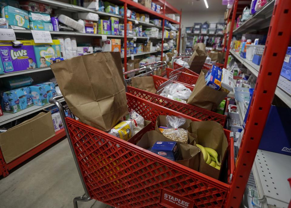 Carts with pre-selected groceries for pickup are seen on Thursday, August 4, 2022, at Operation Bootstrap in Stevens Point, Wis.