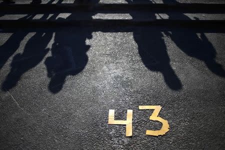 Number 43, in allusion to the missing 43 students from the Ayotzinapa Teacher Training College Raul Isidro Burgos, is seen on the floor outside the City Hall during a demonstration demanding the government find of the students, on the 40th anniversary of the death of late Mexican rebel Lucio Cabanas, in Chilpancingo, Guerrero December 2, 2014. REUTERS/Jorge Dan Lopez