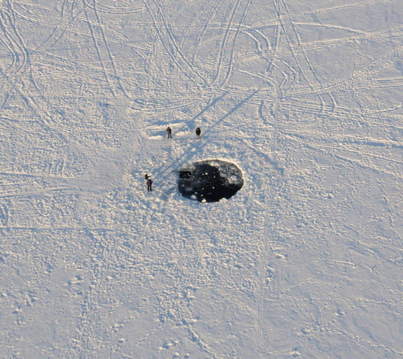 Impact site of the main mass of the Chelyabinsk meteorite in the ice of Lake Chebarkul. Image released Nov. 6, 2013.
