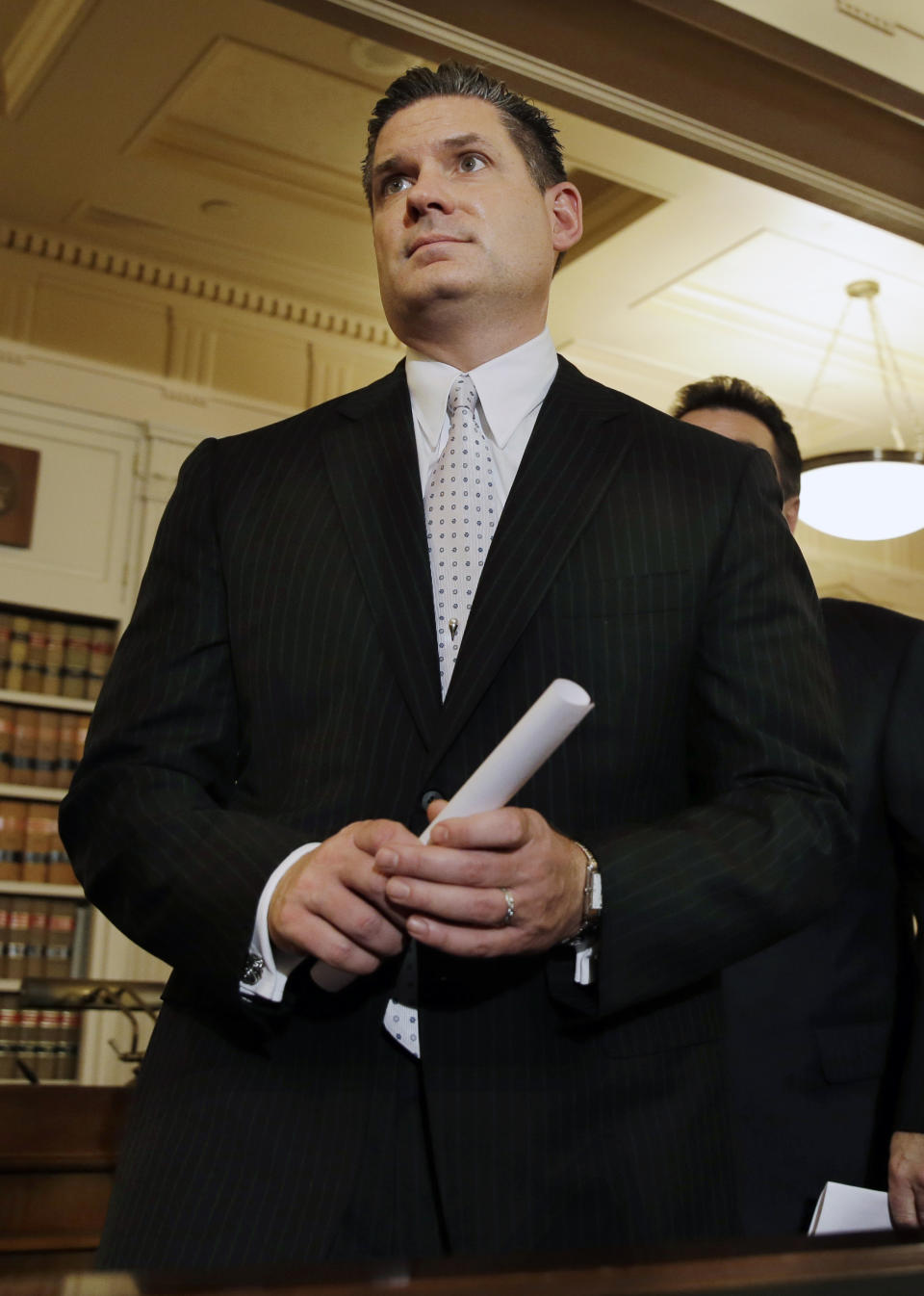 New Jersey Assemblymen Loius D. Greenwald, D-Vorhees, N.J., walks from a news conference Monday, Jan. 13, 2014, in Trenton, N.J. Greenwald, a high-ranking New Jersey Democrat says an investigation into massive local traffic jams that has ensnared Gov. Chris Christie's administration has grown into an abuse of power probe. Greenwald says a new special legislative committee will be tasked with finding out how high up Christie's chain of command the plot went. (AP Photo/Mel Evans)