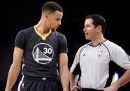 Jan 16, 2016; Auburn Hills, MI, USA; Golden State Warriors guard Stephen Curry (30) talks with referee Brian Forte (45) during the second quarter against the Detroit Pistons at The Palace of Auburn Hills. The Pistons won 113-95. Mandatory Credit: Raj Mehta-USA TODAY Sports