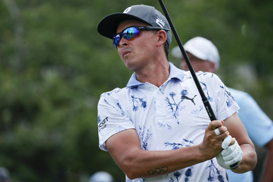 Rickie Fowler hits his tee shot on the tenth hole during the first round of the Wyndham Championship golf tournament, Thursday, Aug. 4, 2022, in Greensboro, N.C. (AP Photo/Reinhold Matay)