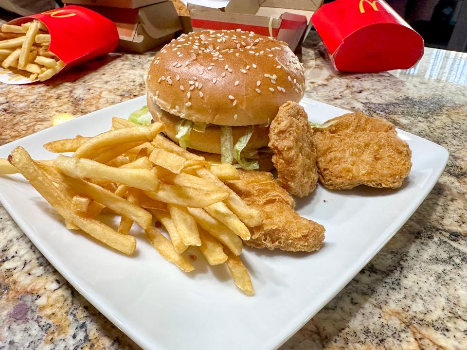 Burger, fries, and nuggets on a plate 