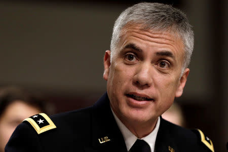 FILE PHOTO: Lt. Gen. Paul M. Nakasone testifies before a senate Armed Services Committee hearing on his nomination to be general and director of the National Security Agency, chief of the Central Security Service and commander of United States Cyber Command, Defense Department; on Capitol Hill in Washington, U.S., March 1, 2018. REUTERS/Yuri Gripas/File Photo