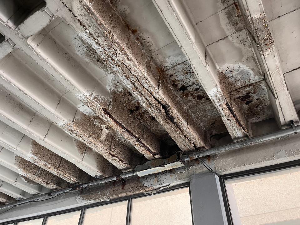 Exposed reinforcements in the Riverview Plaza parking garage, shown in April, are just part of the garage's crumbling infrastructure that have made it unsafe for access.