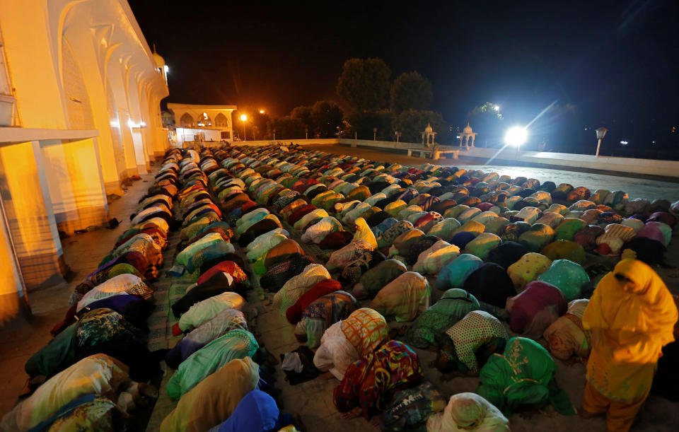 Kashmiri Muslim women offer morning prayers on the death anniversary of Hazrat Ali, son-in-law of Prophet Mohammad, at Hazratbal shrine during the holy month of Ramadan in Srinagar June 17, 2017. REUTERS/Danish Ismail